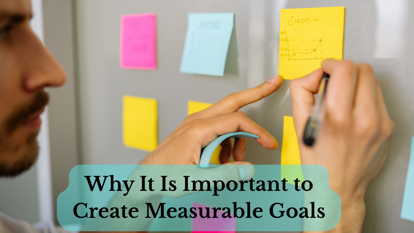 Person writing measurable goals on sticky notes on wall